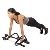 Woman using Huitich steel push up bars performing a push up with black push up stands